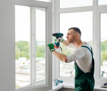 focused-man-doing-window-repair-fixing-adjustment-worker-handyman-agency-home-maintenance-concept-man-doing-window-133446237